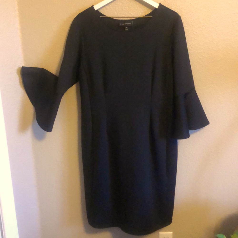 Black scuba dress with bell sleeves.